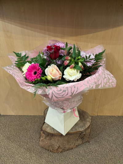 Mrs Kisses - Send lots of love and kisses with this classic hand-tied bouquet featuring a selection of romantic flowers finished with a luxurious single red rose.